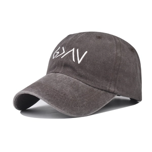 Detailed close-up of white letter embroidery on vintage washed dark grey baseball cap