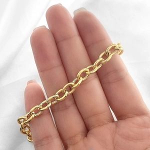 Elegant 18k gold plated chain link bracelet for women shown on a hand with white fabric