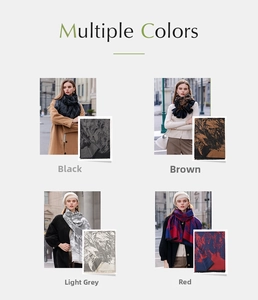 Detail of soft cashmere feel scarves in black, brown, grey and red colors with artistic patterns