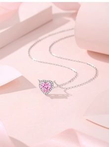 Close-up of S925 silver necklace with pink heart gemstone pendant and pavé diamonds