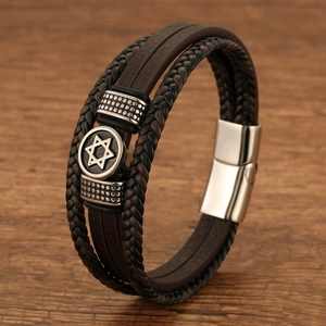 Detailed macro of multi-layer brown leather bracelet with Star of David steel clasp