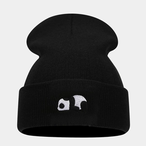 Close-up of cute panda embroidery on a black ribbed knit beanie for winter wear