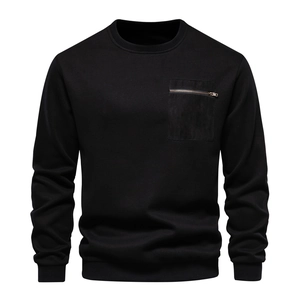 Detail of black crewneck sweatshirt showing chest zipper pocket and ribbed sleeve cuffs
