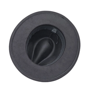 Detail view of black fedora inner lining with 100% polyester tag and 57cm size label