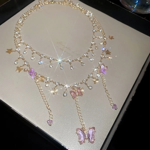 Elegant gold double-layer necklace with sparkling rhinestones and pink resin butterflies