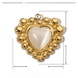 Detail showing heart-shaped gold stainless steel pendant with white natural stone inlay