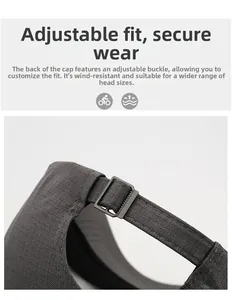 Détail de la casquette grise avec sangle arrière réglable et boucle en métal carrée