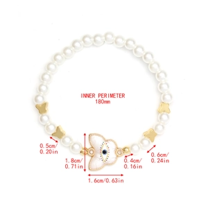Detailed size chart of pearl heart bracelet with butterfly charms and evil eye pendant