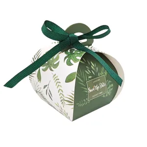 European wedding favor box with tropical leaf pattern and green ribbon bow decoration