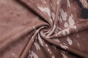 Detailed macro shot of brown leopard print fabric texture and elastic material