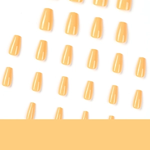 Glossy apricot yellow short ballerina press-on nails set displayed in a grid on white background