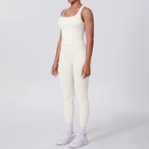 Close-up of cream yoga set showing square-neck tank top and high-waisted leggings