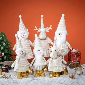 Chic cream and gold Christmas plush figures including Santa and reindeer on snow