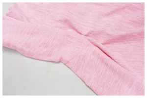 Macro detail of pink melange yoga leggings featuring reinforced seams and gusset crotch