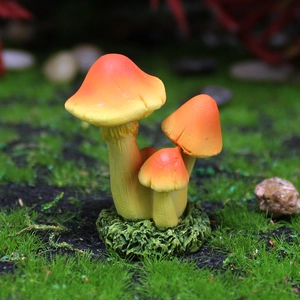 Miniature resin mushroom cluster with orange gradient caps and moss base for garden decor