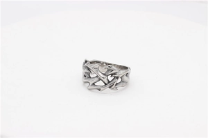 Detailed close-up of Gothic silver titanium steel ring with flame and thorn carvings