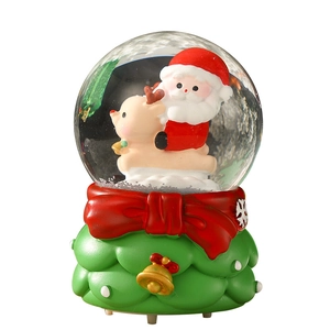Luminous Santa Claus and reindeer snow globe with festive green and red bow base