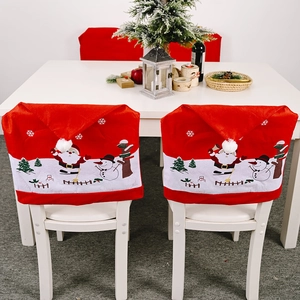 Christmas chair covers set with Santa and Snowman prints in festive home setting