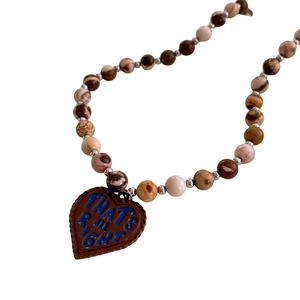 Vintage stone beaded necklace with heart pendant and 'THAT'S ALL RIGHT' engraving