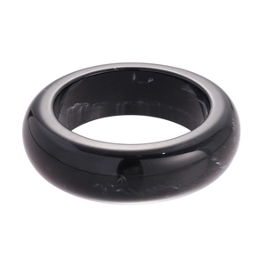 Minimalist black resin bangle with white marble texture in a smooth thick circular design