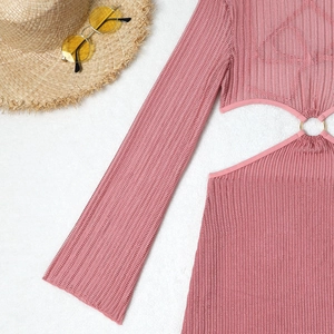 Pink knit beach cover-up with stylish waist cut-outs and golden metal ring details
