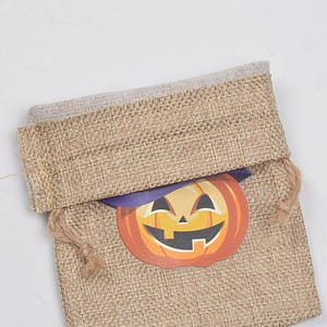 Halloween burlap drawstring gift bag with pumpkin lantern print on white background