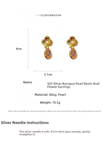 Detailed view of Baroque flower earrings with pearl and purple resin drop charms