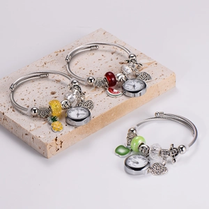 Set of adjustable stainless steel charm watches with fruit and heart pendants on stone