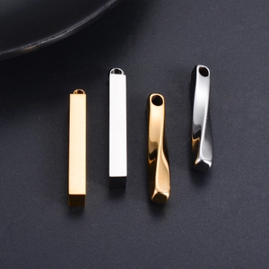 Macro detail of vertical gold and silver twisted spiral and column metal pendants