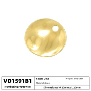 Detailed view of circular brass pendant with vintage coral texture in gold plating