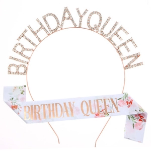 Detailed view of rose gold Birthday Queen crystal crown and satin floral sash set