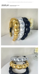 Detailed view of puffed PU leather headbands in metallic gold, silver and black finish