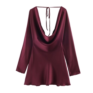 Detail of burgundy satin dress showing the cowl neck and smooth silk texture