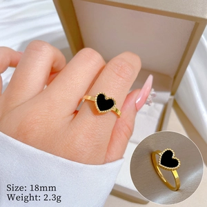 Detail of gold heart ring with black inlay and micro-beaded edges, 18mm size shown