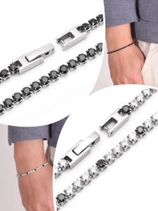 Detail of silver tennis bracelet featuring black and white zircons with secure clasp