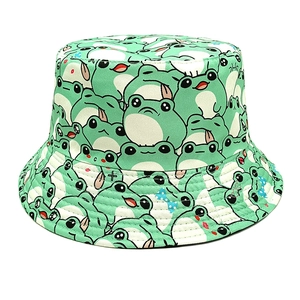 Cute mint green bucket hat featuring all-over cartoon frog patterns and casual cotton design