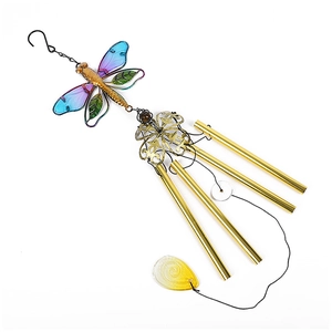Detailed close-up of decorative dragonfly wind chime with golden metal tubes and blue wings