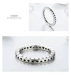 Macro detail showing Forever Love engraving and hollow heart patterns on S925 silver ring