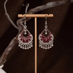Vintage bohemian drop earrings with dark red enamel and silver tassel details