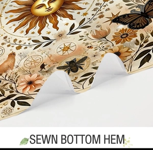 Detail of the sewn bottom hem on a sun and floral pattern polyester shower curtain