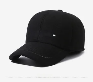 Detail view of black winter baseball cap with white embroidered China script logo