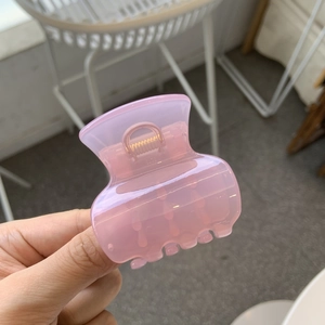 Pink minimalist vase-shaped hair claw clip for high ponytail styling and elegant hair decor
