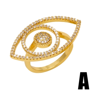 Gold evil eye ring with sparkling diamonds shown from a professional 45-degree angle