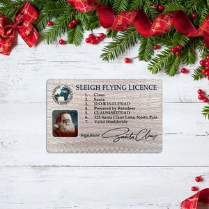 Creative Santa Claus sleigh flying license card with festive pine and berry decorations