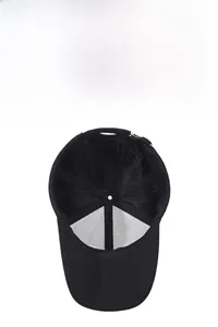 Detail of internal breathable mesh structure and six-panel stitch design on a black baseball cap