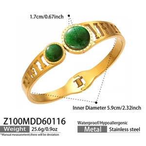 Detail of gold stainless steel bangle with green stone inlays and Roman numerals