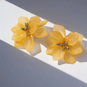 Macro shot of matte yellow floral petals with golden stamens and realistic lighting detail