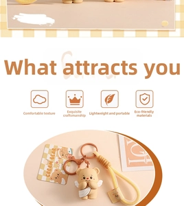 Close-up of cute yellow cream bear keychain with woven strap and branding details