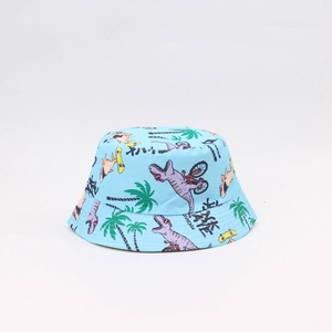 Close-up of light blue kids sun hat featuring colorful cartoon dinosaur and palm tree prints