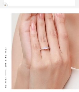 Close-up of elegant S925 silver ring with oval pink zircon and diamond accents